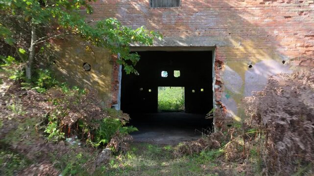Abandoned soviet nuclear missile base. Concrete bunker entrance in a forest clearing