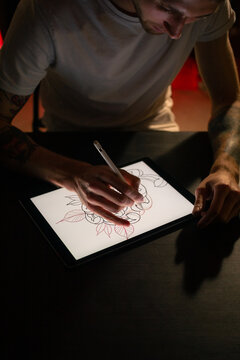 Designer working on new sketch using digital tablet