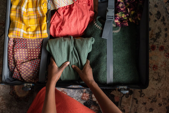 Packing Clothes in a Suitcase Before a Trip