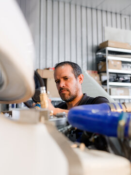 Mechanic is correcting pressure in aircraft system
