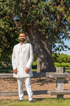 portrait indian man in white traditional outfit