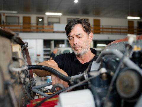 Mechanic is checking aircraft engine condition