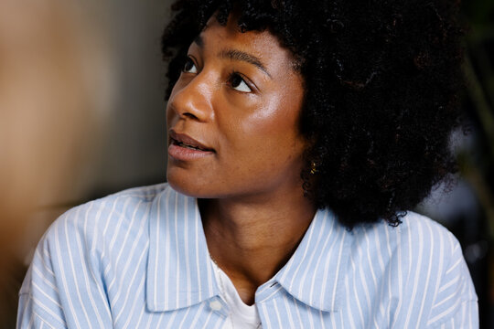 Creative woman listening to the ideas of her co-workers