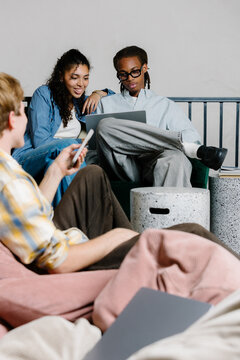 Professionals working together in a living room of modern workspace