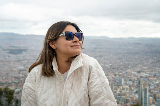 Latina woman enjoying bogota city view from monserrate hill