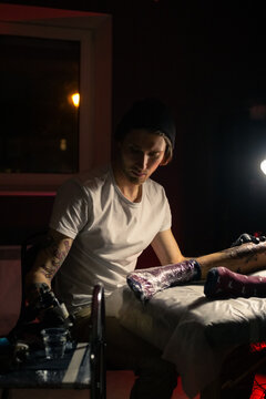 Man working at tattoo studio