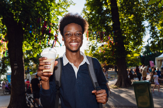 Young Man With Coffee Outdoors