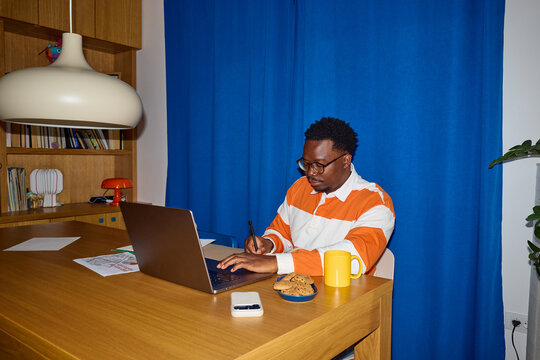 Man works on a laptop