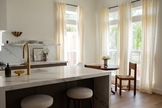 Bright Kitchen With Natural Light and Simple Furniture in Daytime