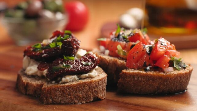 Italian sandwich bruschetta with sun dried tomatoes, fresh tomatoes and cream cheese, close up of Italian appetizer on farm bread with olive oil, Spanish tapas and pinchos