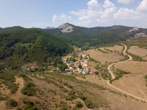 Rural village nestled in green mountain valley picos de europa