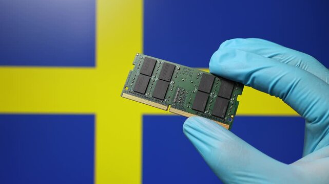 Close up view of hand in blue glove holding RAM memory microchip module. Swedish flag in blurred background. Concept of semiconductor shortage, artificial intelligence development in Sweden.