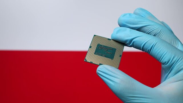 Close up view of hand in blue glove holding CPU microchip. Polish flag in blurred background. Concept of semiconductor shortage and artificial intelligence development in Poland.