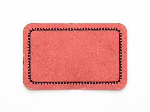 Red velvet fabric with scalloped edge and frayed hem on white background
