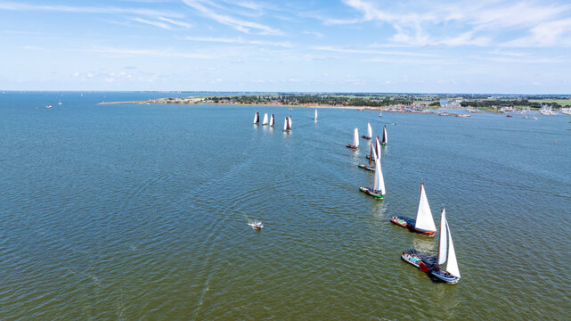 Aerial view of skutsjes sailing a race on the IJsselmeer near Stavoren