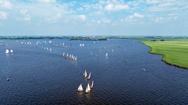 Admiral sailing with classic sailboats on the Heegermeer in the Netherlands