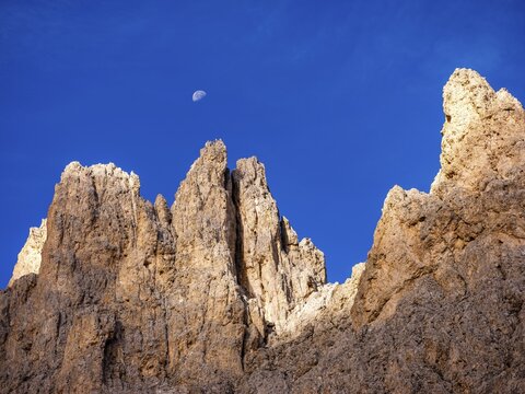 Half moon over the King Laurin wall, rose garden, Dolomites, South Tyrol, Italy