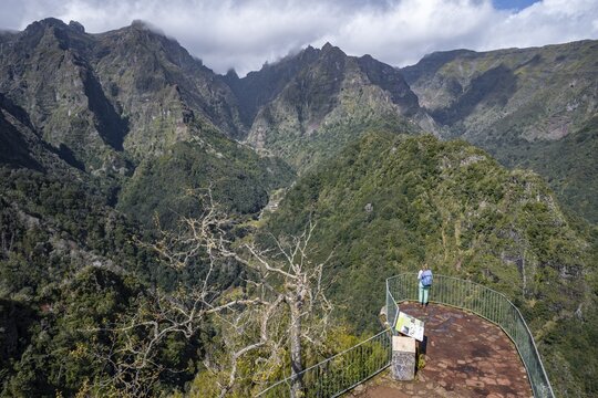 Young woman at Miradouro dos Balc&otilde;es, Ribeira da Metade mountain valley and the central mountains, Madeira, Portugal