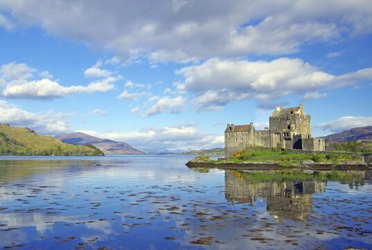 Eilean Donan Castle reflected in water, moated castle, Highlands, Dornie, film locations, Scotland, Great Britain
