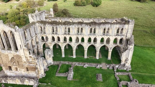 Rievaulx Abbey was a Cistercian abbey in Rievaulx, situated near Helmsley in the North York Moors National Park, North Yorkshire, England