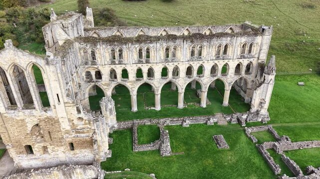 Rievaulx Abbey was a Cistercian abbey in Rievaulx, situated near Helmsley in the North York Moors National Park, North Yorkshire, England