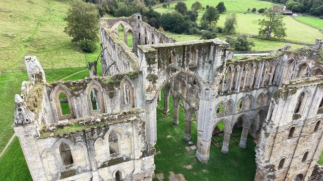 Rievaulx Abbey was a Cistercian abbey in Rievaulx, situated near Helmsley in the North York Moors National Park, North Yorkshire, England
