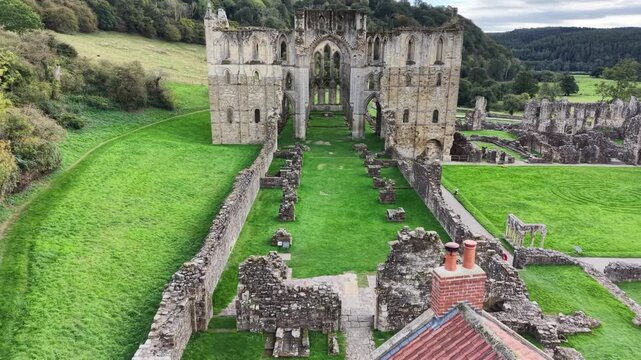 Rievaulx Abbey was a Cistercian abbey in Rievaulx, situated near Helmsley in the North York Moors National Park, North Yorkshire, England