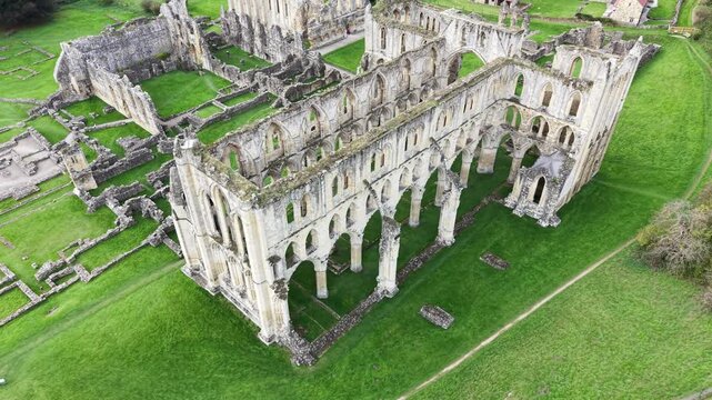 Rievaulx Abbey was a Cistercian abbey in Rievaulx, situated near Helmsley in the North York Moors National Park, North Yorkshire, England