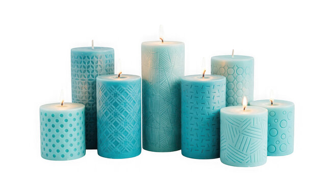 Set of various blue textured wax pillar candles with lit wicks isolated on transparent background