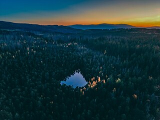 Zlate Hory, 4.10.2026, Czech Republic, Drone view of Velké Mechové jezero in Rejvíz Nature Reserve near Zlaté Hory, Czech Republic, surrounded by dense autumn woodland and colorful foliage
