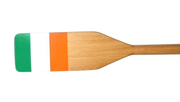 Close up of a wooden oar with Ireland flag of green, white and orange isolated white background