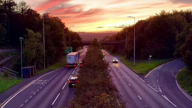 Falmer, East Sussex - October 3rd 2026: vehicles passing on A27 dual carriageway at sunset