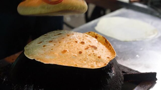 Indian street food paratha making on tawa for kebab paratha