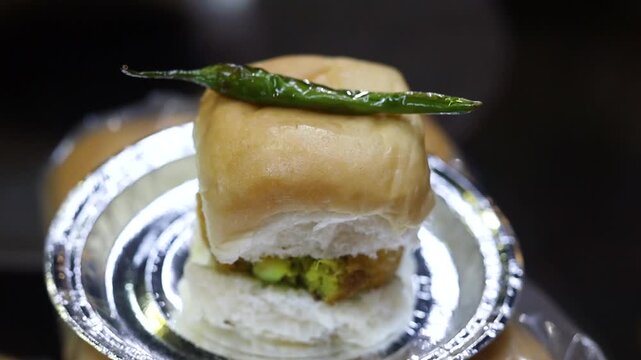 Vada pav served with green chilli 