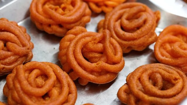 Imarti or jalebi an indian dessert fried in oil then dipped in sugar syrup