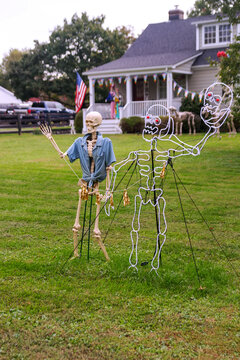 Outdoor Halloween Decorations On Residential Property During Autumn Holiday Season