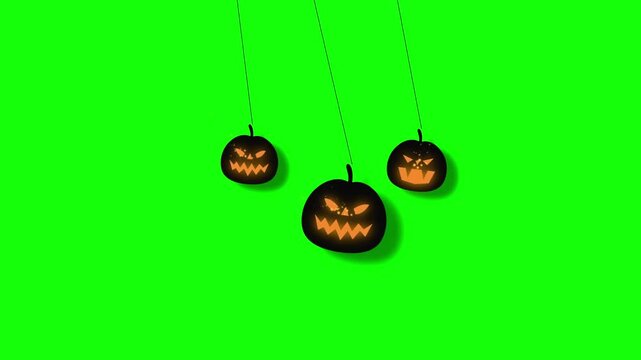 Halloween pumpkin pendulum animation on green screen, spooky glowing jack-o-lanterns swinging for holiday motion