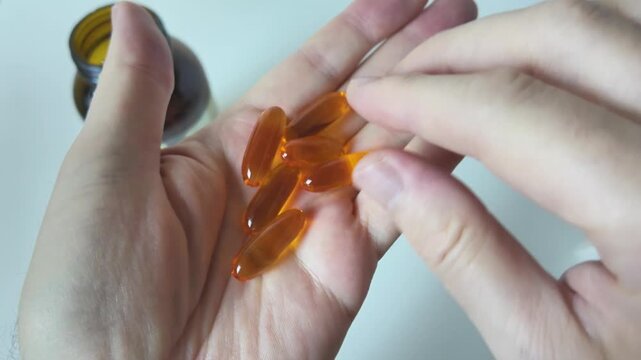 White capsules moving in slow motion close up