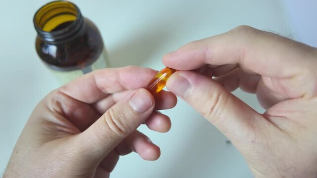 White capsules falling in slow motion close up