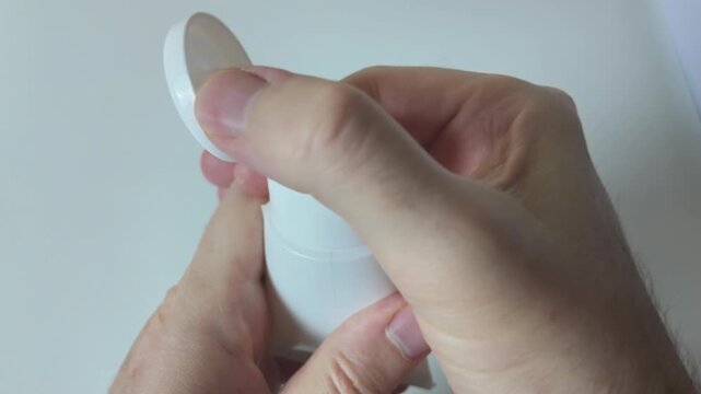 Cosmetic cream container in slow motion close up