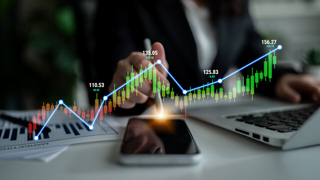 Business person analyzing financial trends with charts and smartphone in an office environment, showcasing growth and investment opportunities Quark.