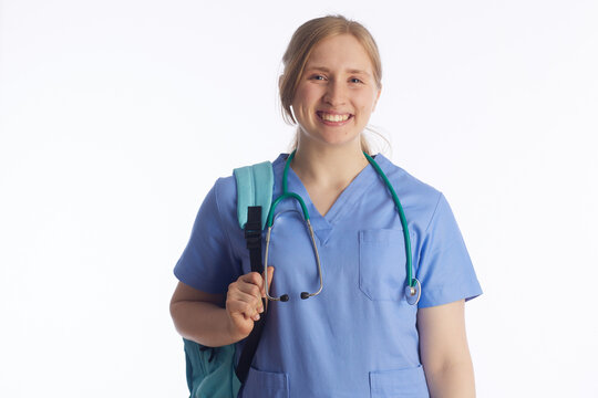 A portrait of a dedicated young nursing student wearing blue scrubs and a backpack, symbolizing the start of a professional healthcare journey and academic preparation.