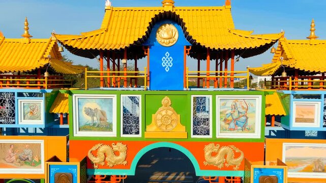 Elista, Russia. The Golden Gate is a Buddhist architectural structure, located near Lenin Square on the Alley of Heroes. Drone footage, Departure of the camera