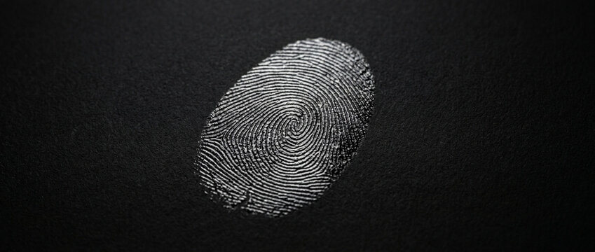 Close up of a White Fingerprint Impression on Dark Textured Background