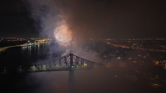 Montreal fireworks over Jacques Cartier Bridge and La Ronde amusement park at night, Quebec, Canada. g