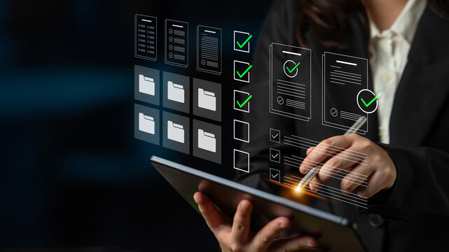 A business professional interacts with a tablet displaying digital documents and workflow icons, highlighting organization and efficiency in a modern office setting. Cyphers