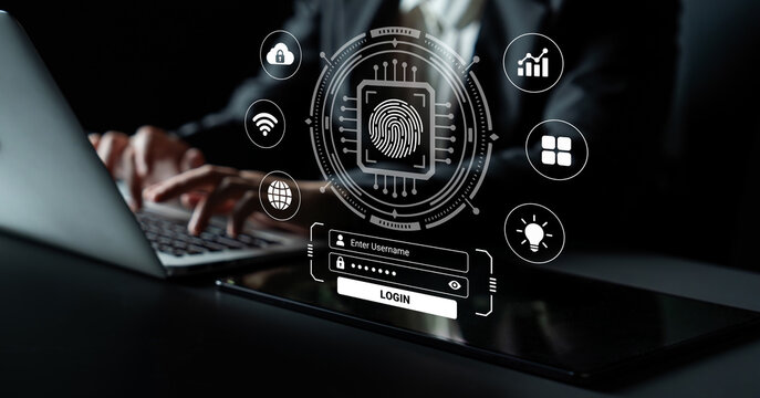 A futuristic digital login interface showcases a fingerprint authentication on a laptop with various cybersecurity icons. Reflects modern technology in business environments. Nascent