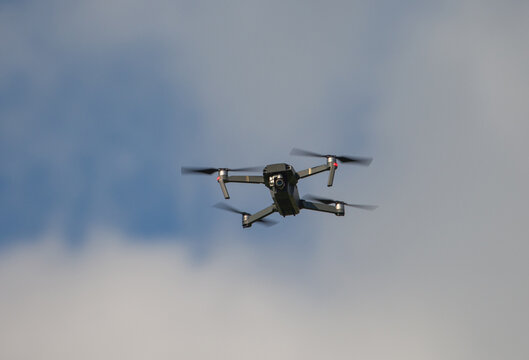 Drone flying in the sky with camera viewed from below