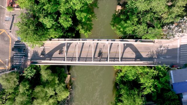 Honda City with Bridges Crossing the Magdalena River in Tolima, Colombia. Establishing Shot. Aerial View.