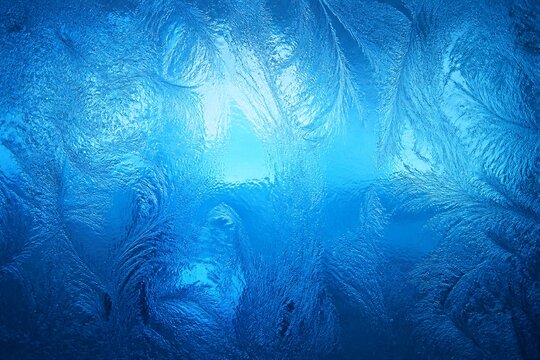 Frosted ice texture forming organic patterns in blue light